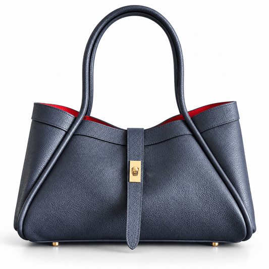 Bag Nova aus dunkelblauem Leder mit goldfarbenem Verschluss und rotem Innenfutter, Vorderansicht
